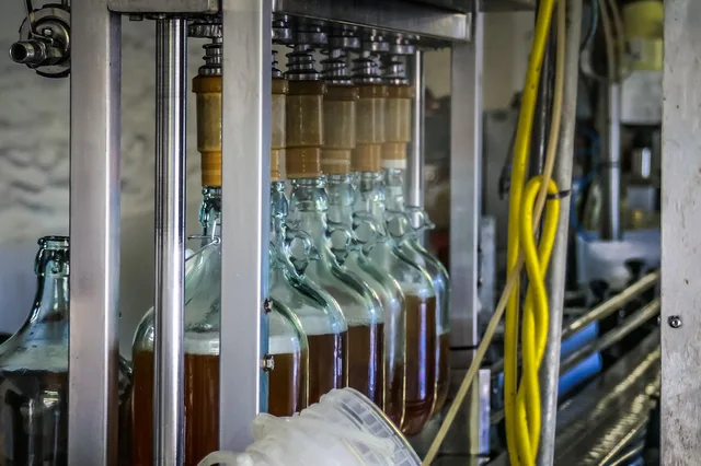 cider, bottling plant, production line, gray bottle, cider, production line, production line, production line, production line, production line. Austin co-packing tiers, market permits and vendor fees
