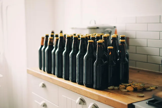 bottles, beer bottles, bottle caps, beer, drink, beverage, vintage, retro, kitchen countertop, kitchen, beer, beer, beer, beer, beer. Co-packing or self-manufacturing in the US, compared on cost and capacity