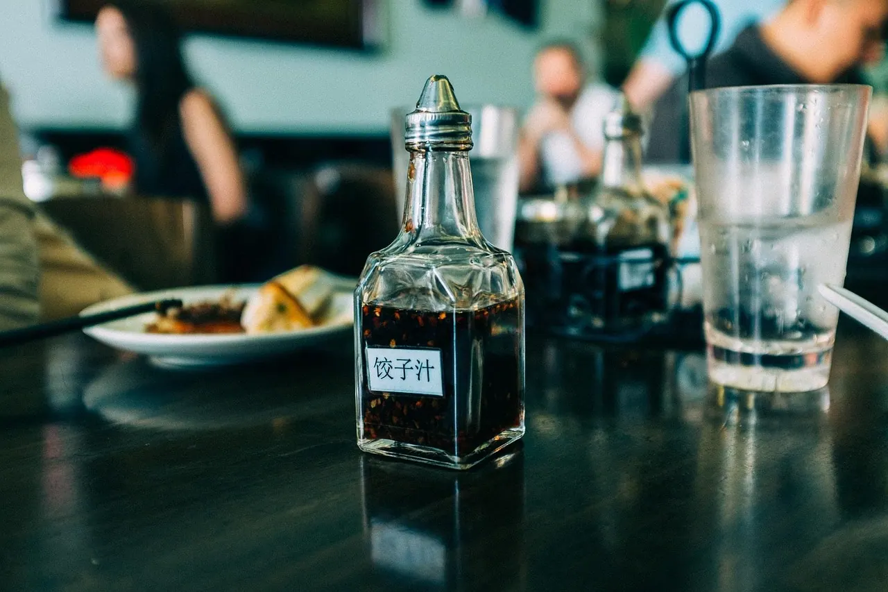 blur, bottle, condiment, food, glass, people, plate, restaurant, sauce, table, restaurant, restaurant, restaurant, restaurant, restaurant